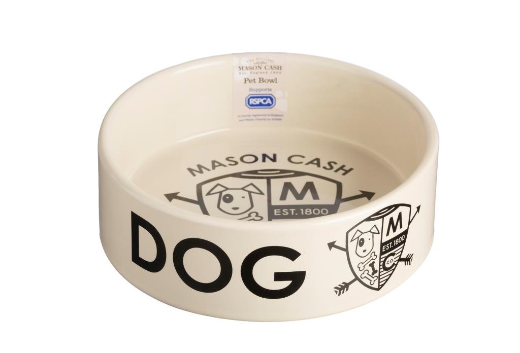 A cream coloured stoneware dog bowl with the word dog written on the side and a coat of arms design inside the bowl with the RSPCA logo.