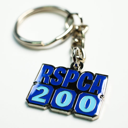 A RSPCA 200 anniversary metal bin badge against a white background. 