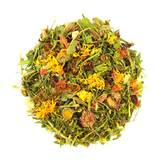 A close-up of a herb salad against a white background.