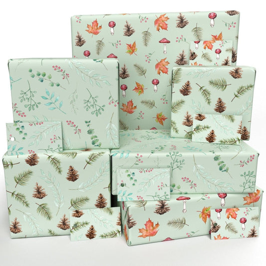 A collection of wrapped presents in woodland, autumnal and floral themed wrapping paper.