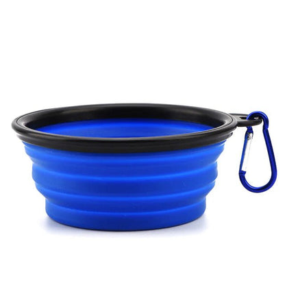 A blue silicone collapsible dog bowl against a white background.