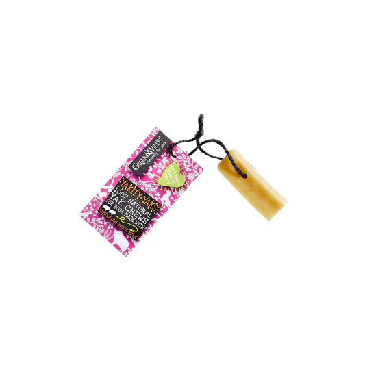 A Yakity Yak Chew with a pink and white tag attached, the tag features illustrations of dogs and yaks.