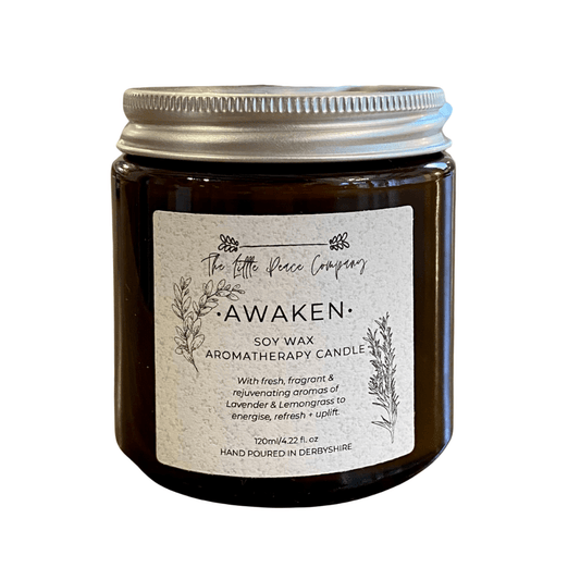 A soy wax aromatherapy candle in a brown jar, against a white background.