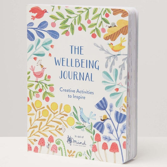 A colourful and illustrated wellbeing journal stood up against a white backdrop.